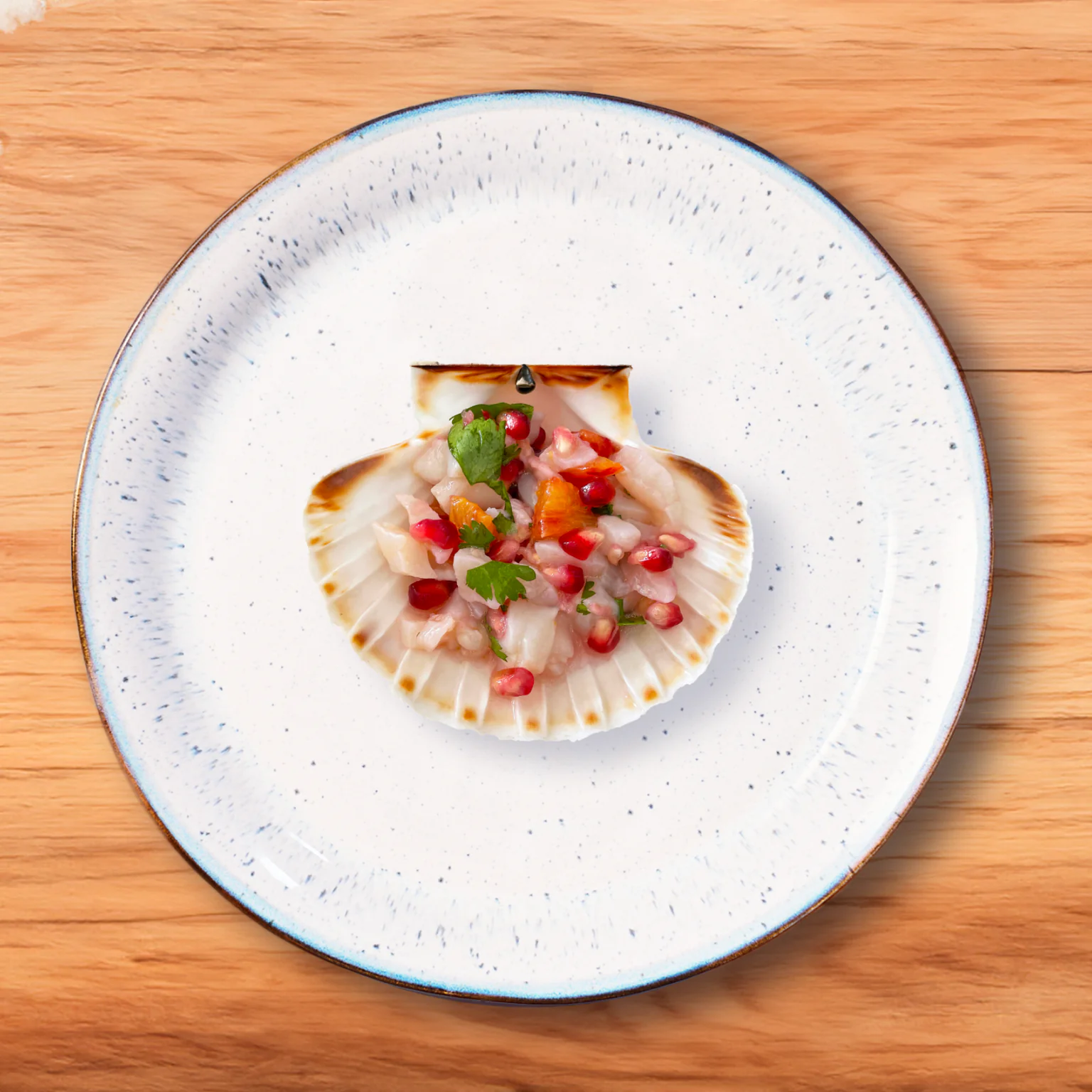 Recette coquilles Saint-Jacques en tartare avec grenade et coriandre. 